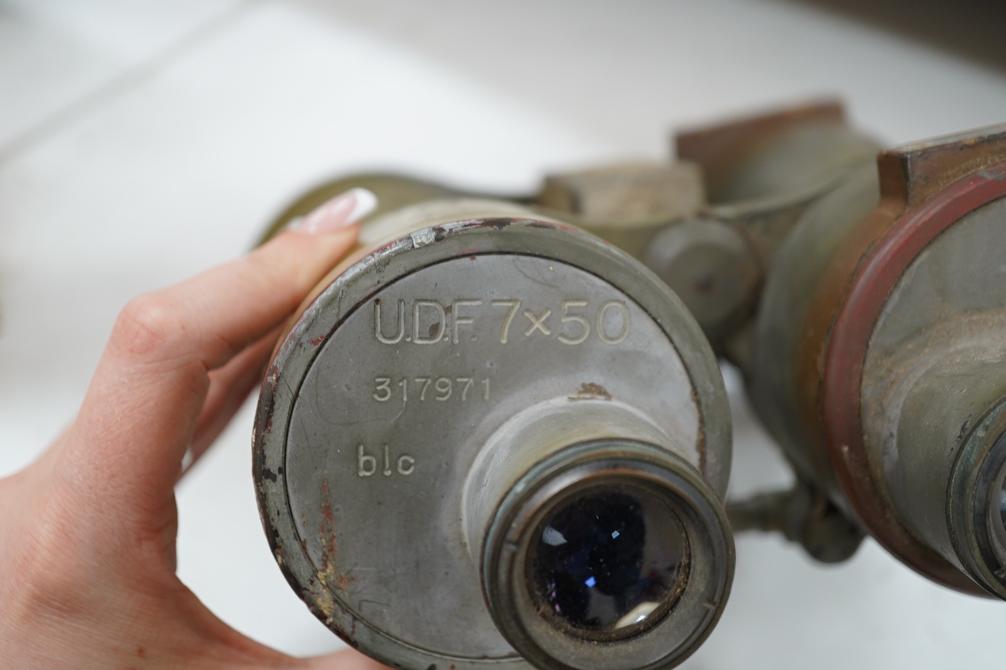 A pair of WWII German U boat coning tower binoculars stamped; U.D.F. 7x50 317971 blc, 20.5cm long. Condition - poor, all lenses damaged, one shattered, and general wear overall.